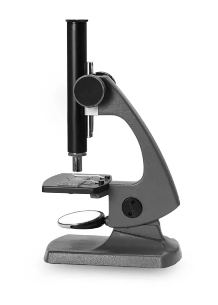 old  microscope on white background