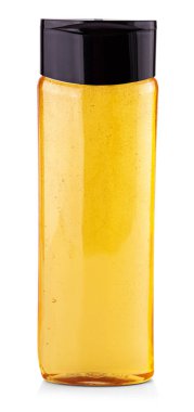 Beyaz arka planda sarı şampuan şişesi