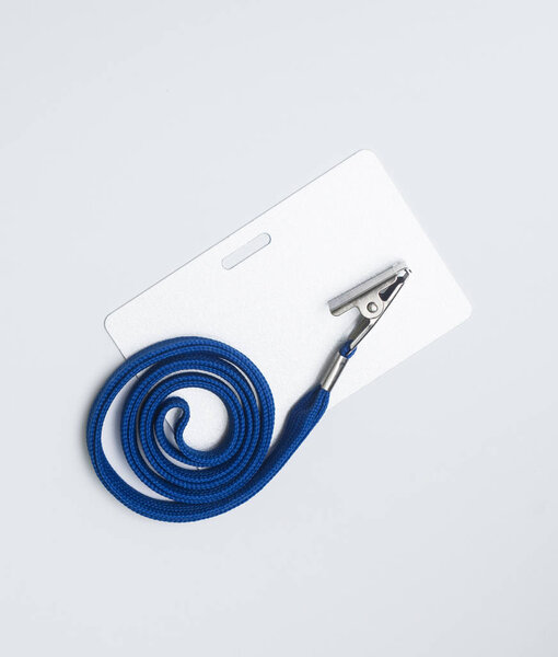 Lanyard and badge. Conference badge. Blank badge template in plastic holder with blue strap.