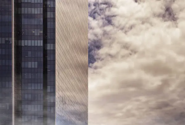 Adjusted image of high building in mist with orange tone — Stock Photo, Image