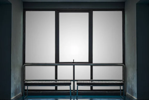 Big window and bench with old blue wall — Stock Photo, Image