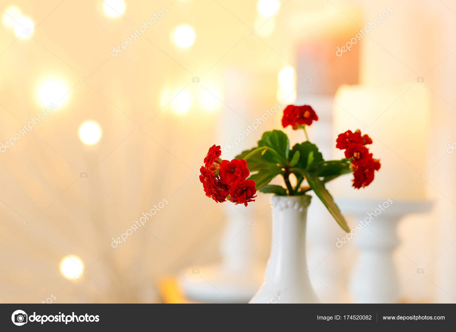 Flowers In A Vase Against A Backdrop Of Candles And Lights
