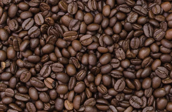 Φρυγμένους κόκκους καφέ. Γκρο πλαν, κόκκους καφέ για το φόντο. — Φωτογραφία Αρχείου