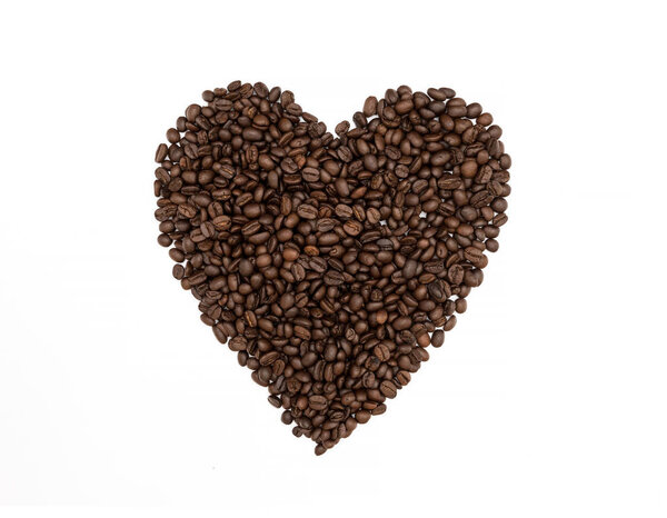 Heart of coffee beans isolated on white background.