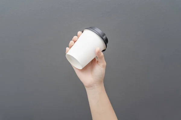 Take away coffee cup background. Female hand holding a coffee pa