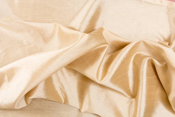 Golden wavy fabric texture / background. — Stock Photo, Image