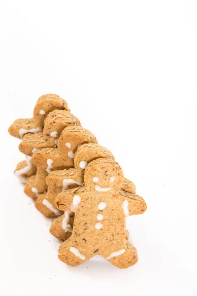 Gingerbread men cookies, on white background with copy-space. — Stock Photo, Image