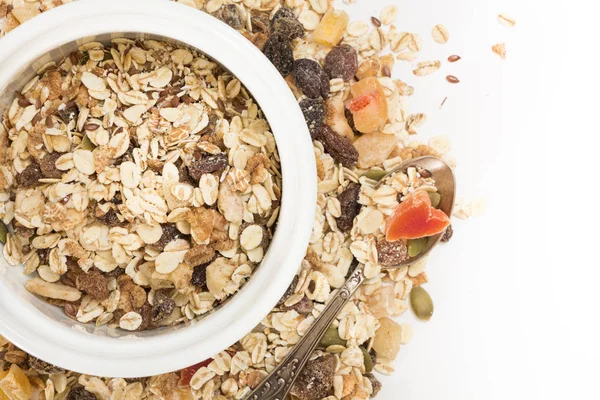 Bowl of muesli with dry fruits, on white background. — Stock Photo, Image