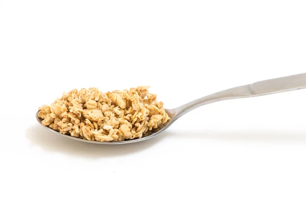 Kanállal granola, fehér háttér. — Stock Fotó