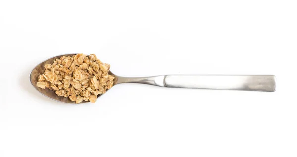 Spoon with granola, on white background. — Stock Photo, Image
