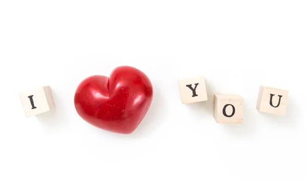 Red heart and wooden cubes with I and You, on white background. I love you concept. — Stock Photo, Image