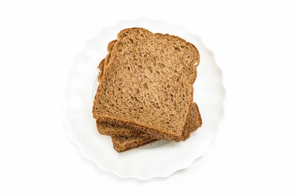 Whole grain sandwich bread slices on plate, on white background. — Stock Photo, Image