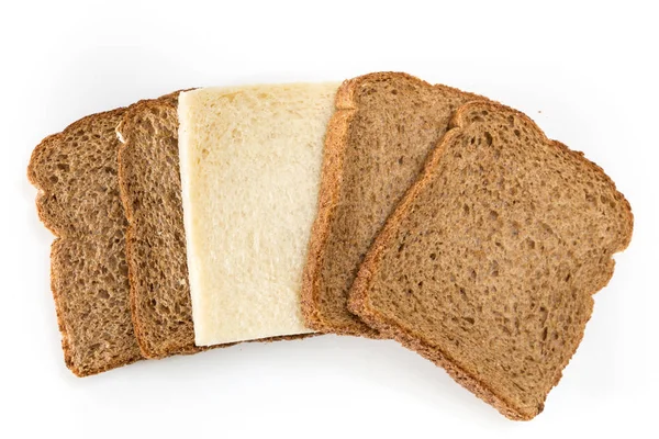 Whole grain sandwich bread slices with one white slice, on white background. — Stock Photo, Image