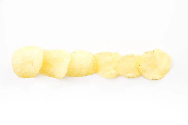 Crispy thinly sliced potato chips, on white background. — Stock Photo, Image