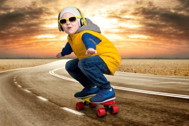 Boy doing tricks on a skateboard,skate on the road.The little boy in the style of Hip-Hop . clipart