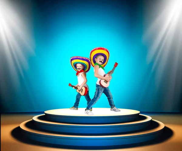 Mexican party.Two boys in sombrero with a guitar on stage.Mexican macho. — Stock Photo, Image