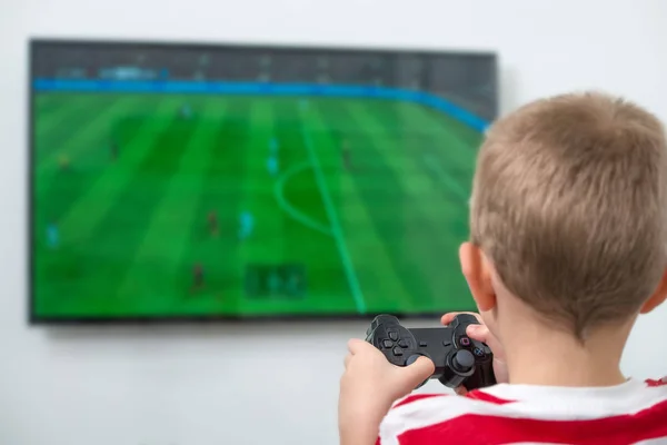 Boy with joystick playing video game at home. — Stock Photo, Image