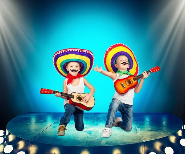 Mexican party. Two brothers in sombreros perform on stage, sing serenades.
