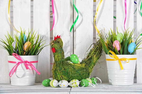 Hen made from straw with Easter eggs.Easter decorations handmade .Easter holiday concept.