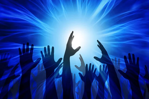 Hands raised in front of the light — Stock Photo, Image