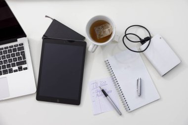 Office equipment on a desk from above clipart