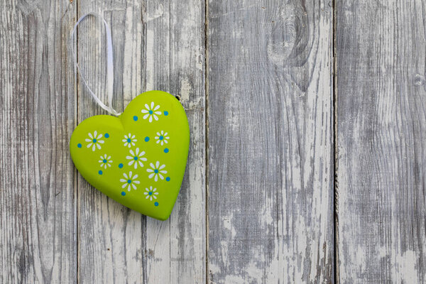 Heart shape on wooden background