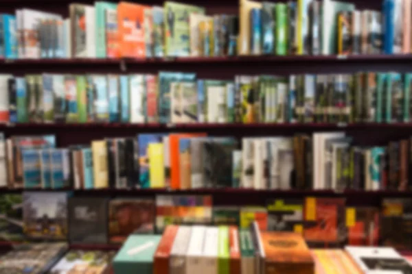 Bookstore blur background with miscellaneous books shelf — Stock Photo, Image