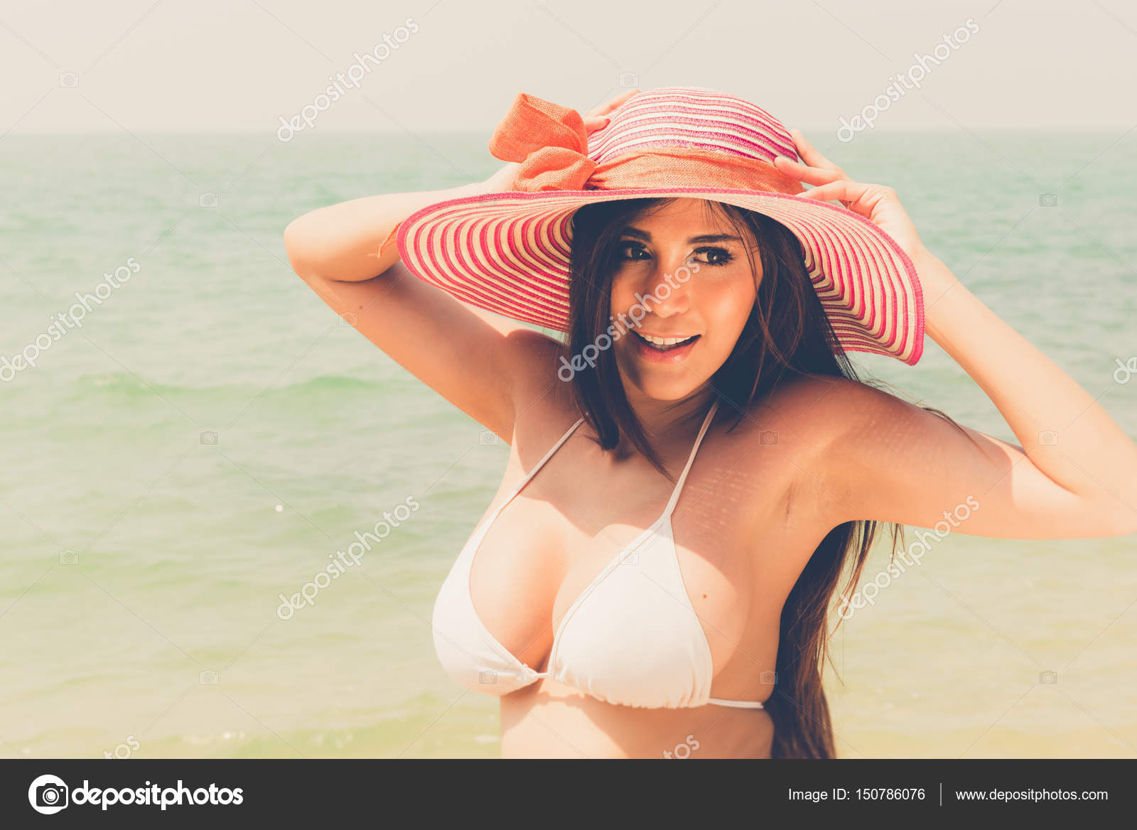 Beautiful attractive large breast asian bikini woman posing sexy Stock  Photo by ©sasilsolution 150786076