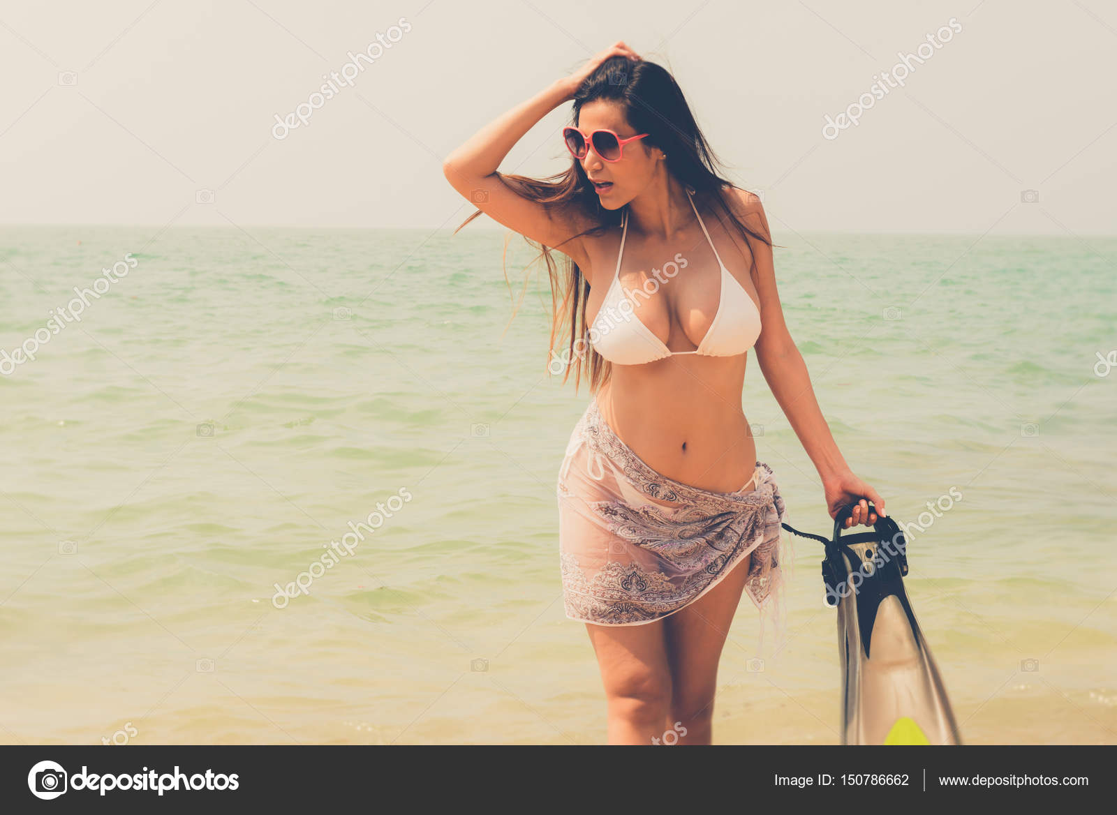 Beautiful attractive large breast asian bikini woman posing sexy Stock  Photo by ©sasilsolution 150786662