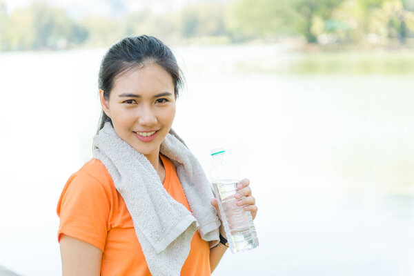 Portrait of attractive confident smile young Asian woman runner 