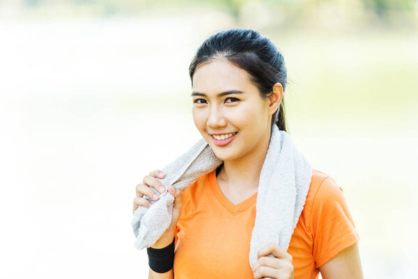 Portrait of attractive confident smile young Asian woman runner 