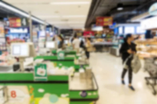Blur background of large indoor grocery store in asia.
