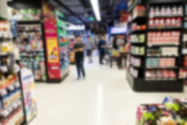 Blur background of large indoor grocery store in asia.
