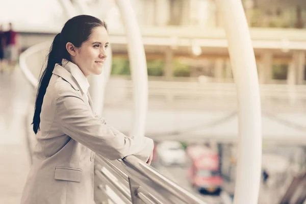 Portrait of confident business woman. Young professional career business woman standing  outside looking confident. Apply vintage effect. For young woman leadership, career path concept.