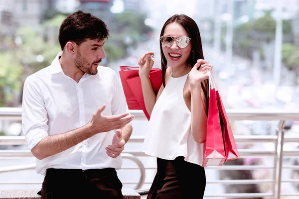 Couple argue after a hard day of huge sale shopping in asian cou — Stock Photo, Image