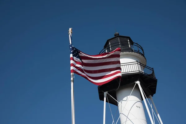 Lighthouse with United States flag in Conney Island - New York.