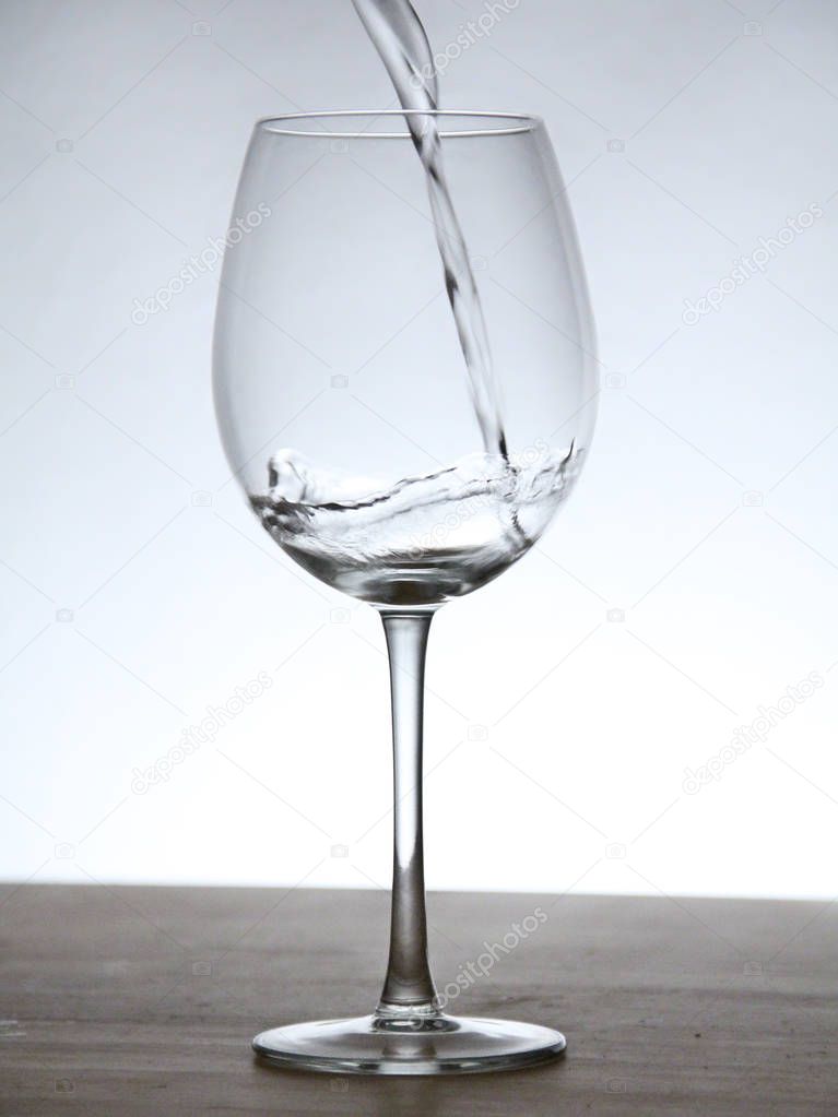 Still of a glass with background light.