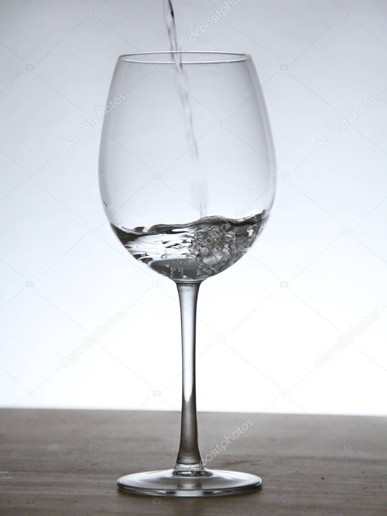 Still of a glass with background light.