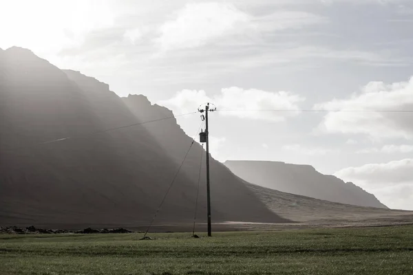 Power pole with sunset in Iceland. Light and shadow over the lan — Stock Photo, Image