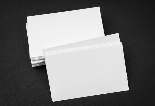 Business cards on black background .