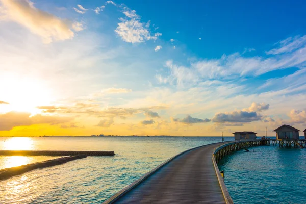 Beautiful sunrise with  water villas  in tropical Maldives islan — Stock Photo, Image