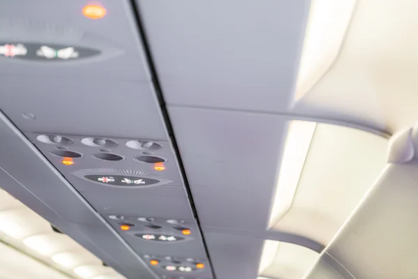 No smoking sign and seat belt sign on the airplane . — Stock Photo, Image