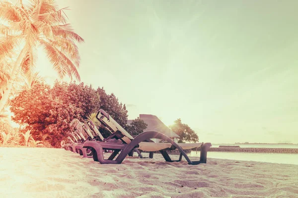 Beach chairs in Maldives island at the sunrise time . ( Filtered — Stock Photo, Image