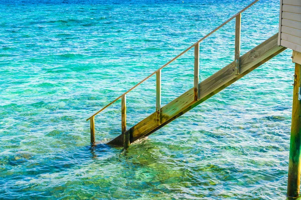 Wood stair into the sea of tropical Maldives island