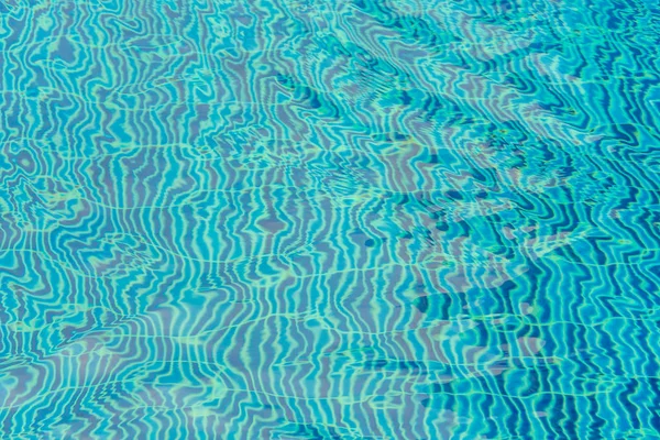 Blue swimming pool rippled water . — Stock Photo, Image