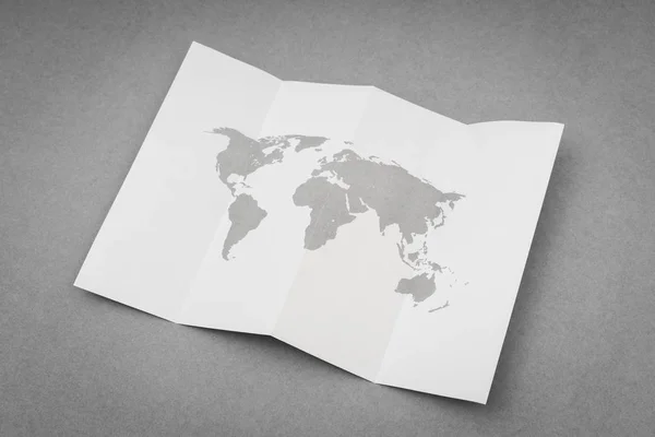 Papel doblado con mapa del mundo  . —  Fotos de Stock