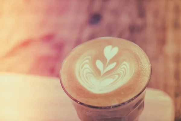 Hot latte art coffee on table ( Filtered image processed vintage — Stock Photo, Image