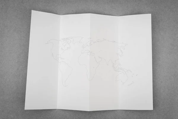 Χαρτί διπλωμένο με παγκόσμιο χάρτη . — Φωτογραφία Αρχείου