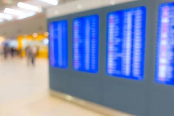 Abstract blur flight information  screen in airport terminal . — Stock Photo, Image