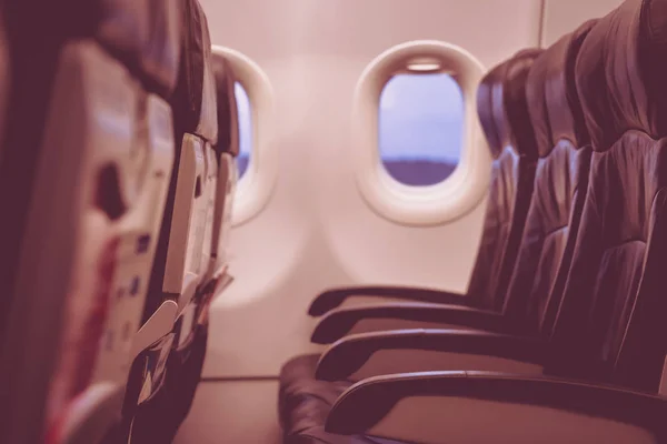 Airplane seats in the cabin ( Filtered image processed vintage e — Stock Photo, Image